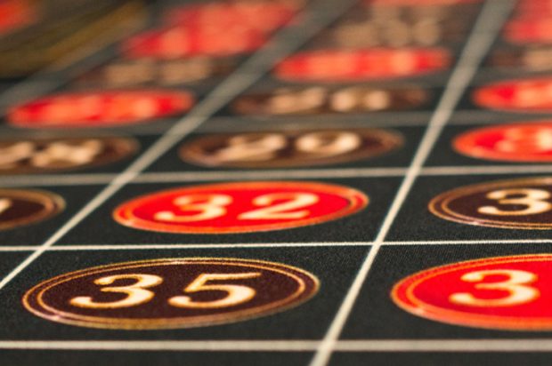 A close up of numbered squares on a casino blackjack table
