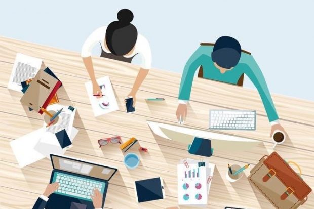 Overhead illustration of people working together on a shared office desk.